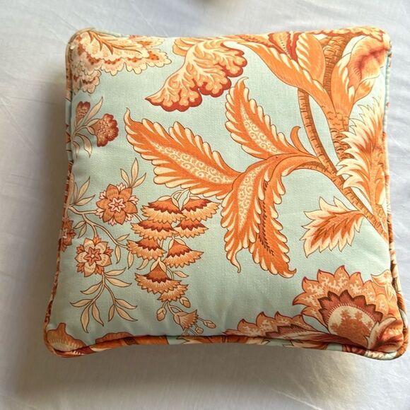 Orange and blue decorator pillow, 14X 14 in